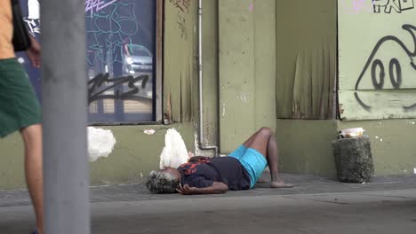 Homeless-man-sleeping-rough-on-the-street-in-the-city-center-of-Kuala-Lumpur