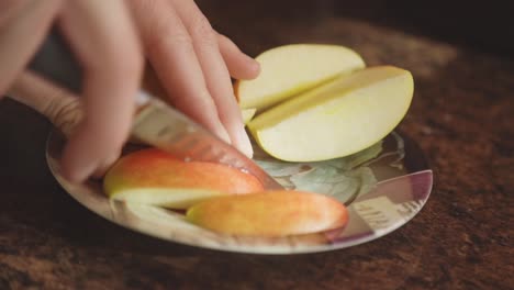 Nutritious-And-Healthy-Apple-Fruit-Being-Sliced-With-A-Paring-Knife