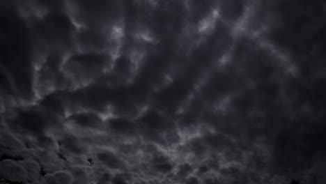 Spooky-clouds-night-scape-illuminated-under-a-full-moon