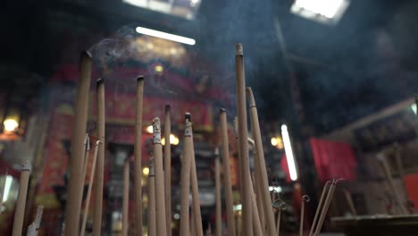 Incense-burning-in-a-Chinese-temple,-focus-in-the-foreground,-Rabbit-year-celebrations
