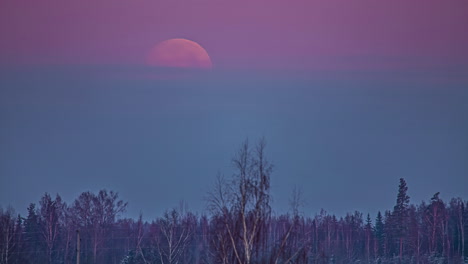 Massive-bloody-moon-setting-down-into-grey-cloudscape,-fusion-time-lapse