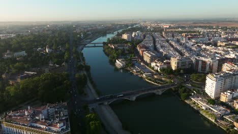 Aerial-Panoramic-View-Of-Seville-City-And-River-Guadalquivir-During-Dawn-In-Andalusia,-Spain