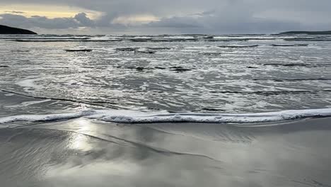 Slow-motion-movement-waves-on-a-sandy-beach-in-wintertime-in-Ireland