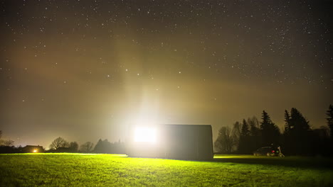 Stunning-night-sky-time-lapse-with-clear-shining-starts-rotating-and-shootings-starts-flying-across-the-sky-in-a-forest-with-a-shed