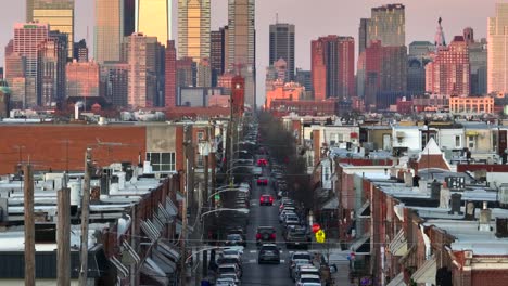 Long-aerial-zoom-tilt-up-reveal-of-Philadelphia-skyline-from-south-Philly-housing-neighborhood