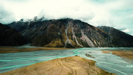 Mount-Cook-National-Park,-New-Zealand-Drone-of-Mountains-and-Blue-Streams