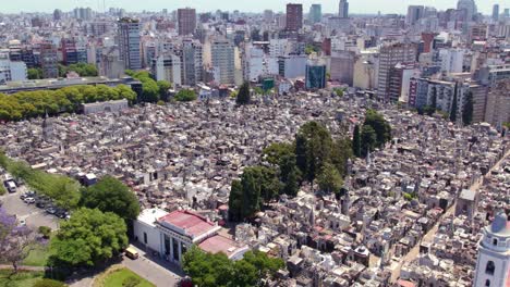 Panoramic-aerial-view-of-the-Recoleta-cemetery-with-its-mausoleums-and-tombs,-religious-structure-and-residential-buildings-around,-a-tourist-site-in-Buenos-Aires