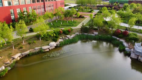 Cinematic-aerial-view-of-an-artificial-lake-in-Beijing-Jiaotong-University,-Weihai-campus,-China