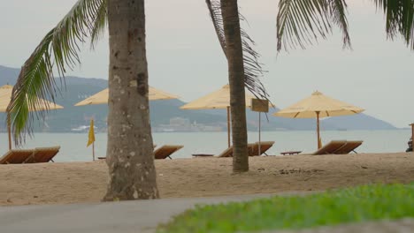 Relax-on-beach-chair-with-beautiful-lanscape-on-the-front-in-Nha-Trang-beach-city-footage-in-4k-resolution