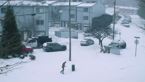 Man-walking-during-windy-snow-storm