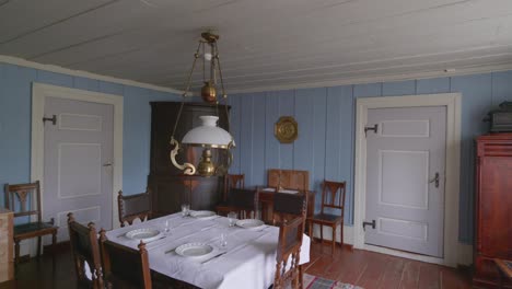 Pan-shot-of-vintage-Scandinavian-dining-room-in-Antique-Home-Setting