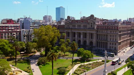 Aerial-view-dolly-in-of-the-Supreme-Court-of-Argentina,-Plaza-Lavalle-on-a-sunny-day