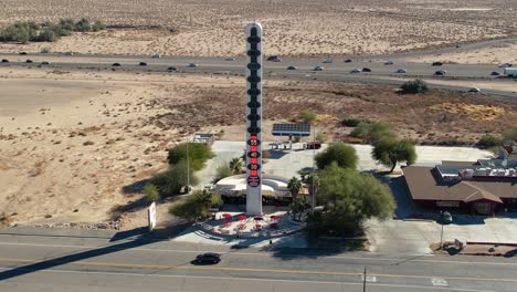 Aerial-Drone-Descending-Over-World's-Tallest-Thermometer-Landmark-Attraction-In-Baker,-Recording-Death-Valley,-California