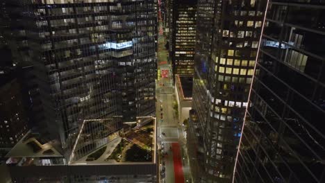 Flying-over-a-quiet-street-in-the-city-center-of-Houston,-dawn-in-Texas,-USA---Aerial-view
