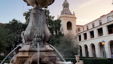 Centennial-Square-in-courtyard-of-Pasadena-City-Hall,-slow-motion-pan-up-to-the-sky-at-sunset
