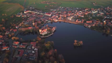 Picturesque-aerial-scene-of-Flechtingen-water-castle,-Wasserburg-Flechtingen,-Germany