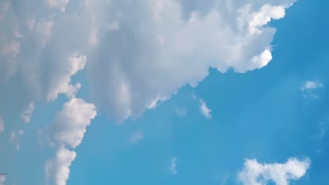 Timelapse-of-beautiful-blue-sky-with-clouds-on-a-bright-sunny-day-for-moving-abstract-background
