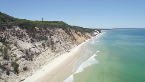 Turquoise-Ocean-And-White-Sandy-Shore-At-Rainbow-Beach,-Queensland,-Australia---aerial-drone-shot