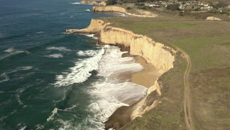 Coastline-of-Davenport,-California.-Drone-tilt-up-reveal-shot