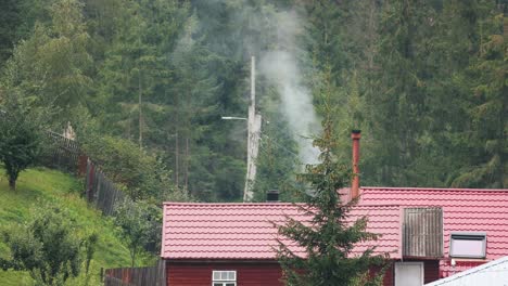 Chimney-Smokes-From-The-Roof-Of-A-Cottage-In-The-Countryside