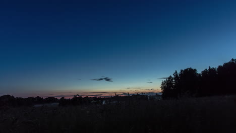Beautiful-time-lapse-of-a-late-sunset-and-the-dusk-setting-in-above-the-silhouette-of-trees