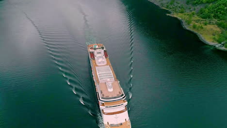Aerial-shot-of-huge-ferry-making-ripples-in-the-water