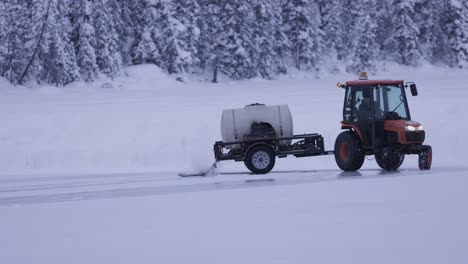 Tractor-on-Frozen-Lake-Creating-Ice-Rink,-4K,-Banff-Alberta