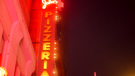 John's-Of-Times-Square---Illuminated-Neon-Sign-Of-Famous-Pizzeria-At-Night-In-New-York-City,-New-York