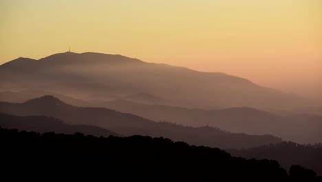 Time-lapse-of-foggy-landscape-of-mountains-layers