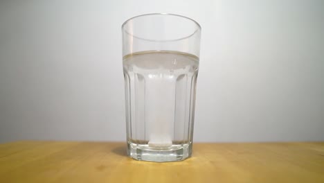 Effervescent-tablet-is-dissolved-in-a-glass-of-water
