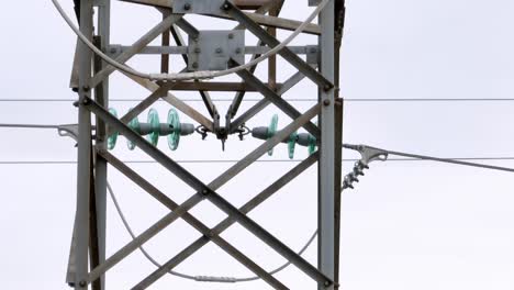 Close-up-view-of-a-transmission-tower,-aerial-drone-video