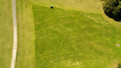 Aerial-panning-view-over-vehicle-mowing-the-lawn