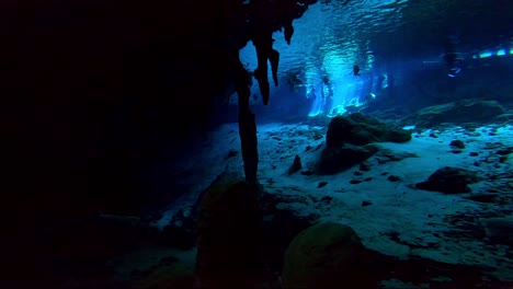 Cavern-opening-with-crystal-clear-water