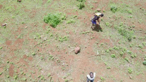 Drone-flying-in-farms-in-kilimanjaro-slopes--Green-Kenya-farms,-poor-settlement-africa-aerial-agronomic-plantation