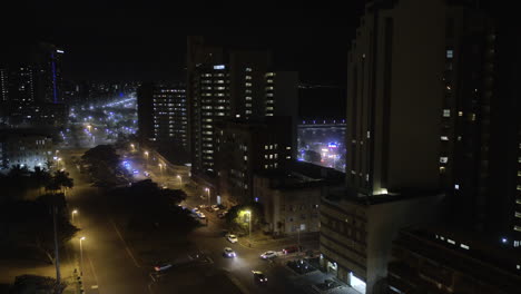 Aerial-drone-shot-of-Durban-city-centre-at-night-with-cars-on-the-roads