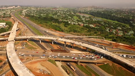 Aerial-drone-of-a-busy-highway-interchange-under-construction