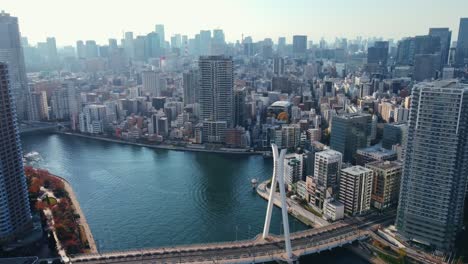 Aerial-Drone-Reveal-Shot-Flying-Over-River-In-Tokyo-City-Japan
