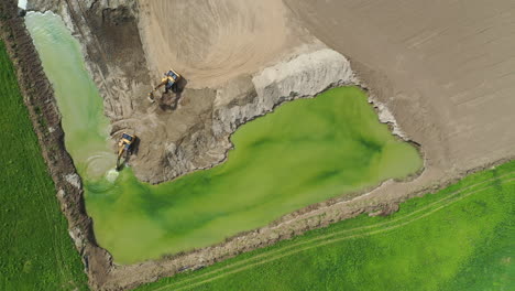 Aerial-shot-of-heavy-machinery-on-construction-site-quarry-in-Hungary