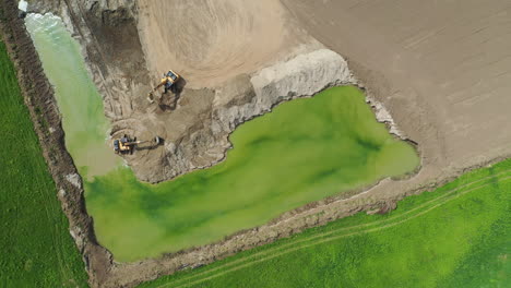 Aerial-shot-of-heavy-machinery-on-construction-site-or-quarry