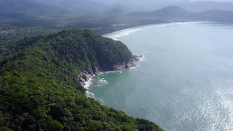 Aerial-overview-of-the-rocky-and-mountainous-coast-of-sunny-Costa-Verde,-Brazil---panoramic,-drone-shot