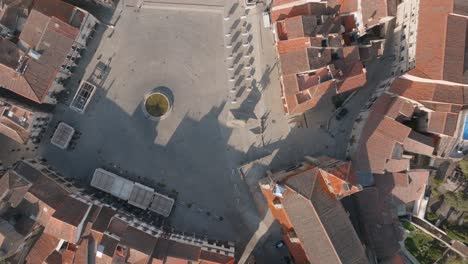Aerial-birds-eye-view-of-historic-church-in-Trujillo's-main-square,-Extremadura,-Spain