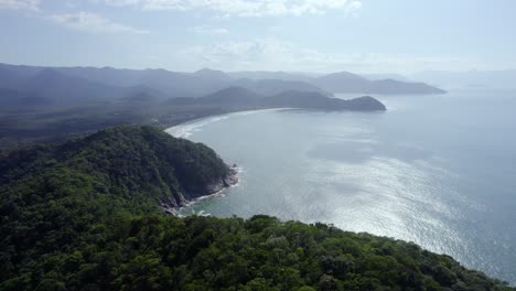 Flying-over-green,-seaside-mountains-in-sunny-Costa-Verde,-Brazil---aerial-view