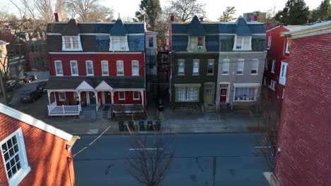 Aerial-pass-through-houses-revealing-row-house-on-opposite-side-of-street