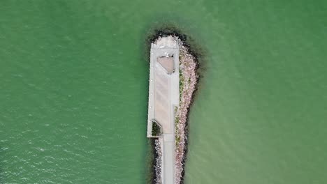 Aerial-View-of-a-Pier-with-Waves-of-the-Lake