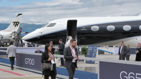 Attendees-of-EBACE-look-at-Gulfstream-G700-business-aircraft-at-apron