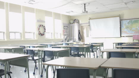 Tilt-down-reveal-of-classroom-empty-desks