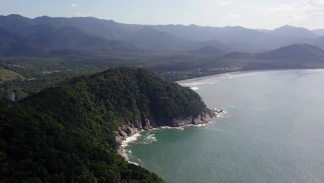 Rising-aerial-view-of-the-mountainous-green-coast,-Costa-verde,-in-sunny-Brazil