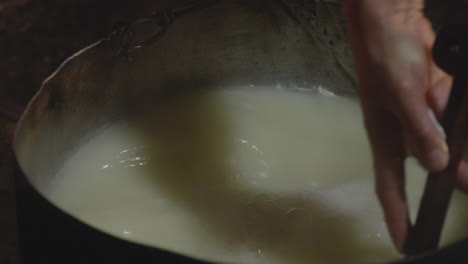 Stir-in-Pot,-Setting-Milk-Into-Curd,-Cheese-Making,-Chobareti-Georgia,-Close-Up