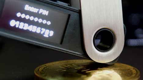 Very-close-up-of-ledger-nano-on-top-of-bitcoin-coin