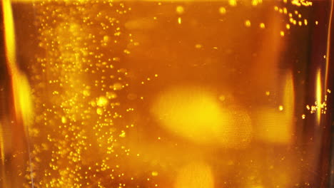 Extreme-Close-up-of-craft-Beer-bubbles-floating-to-the-top-of-a-pint-glass
